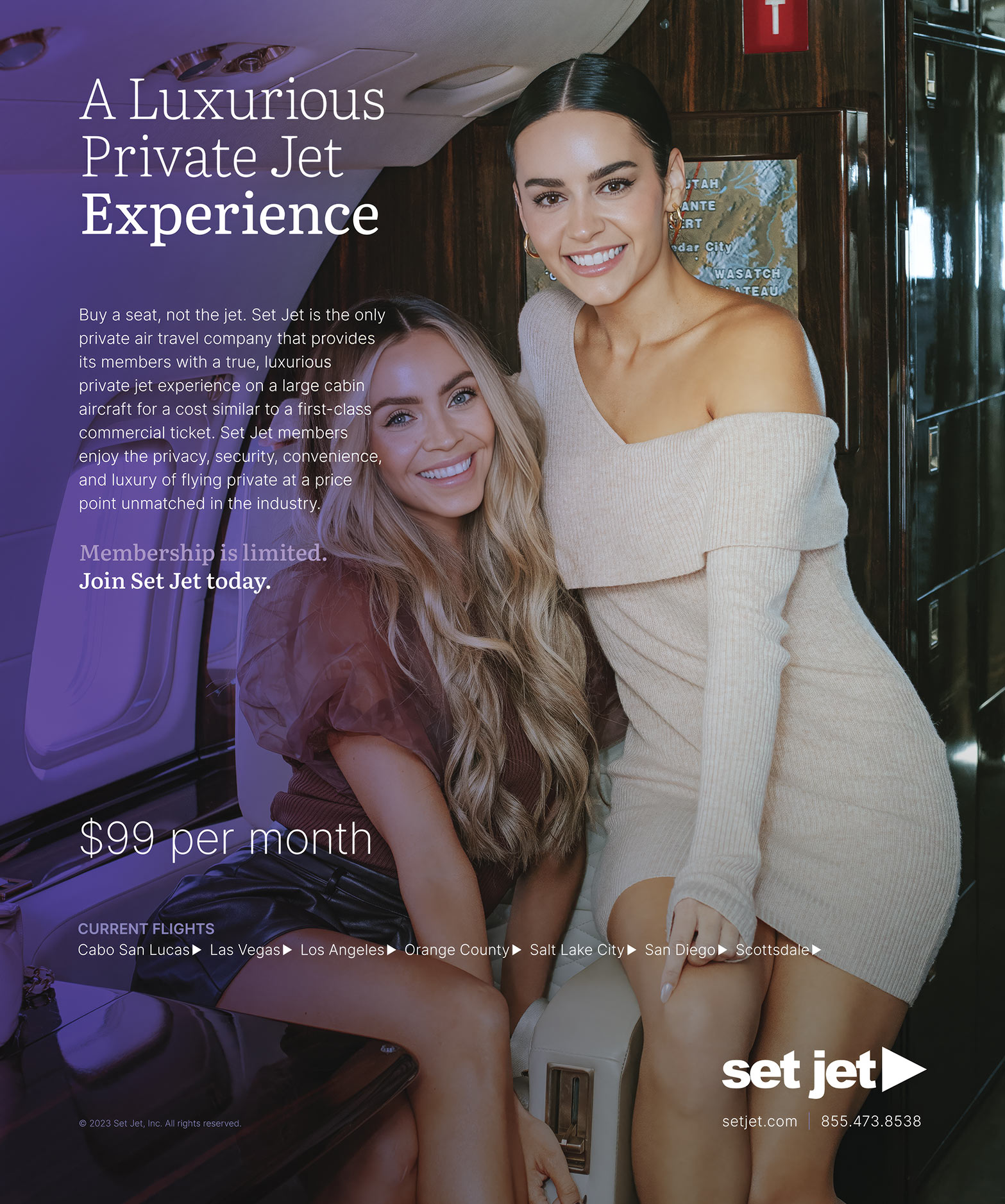 Two women smiling and posing together inside a luxurious private jet.